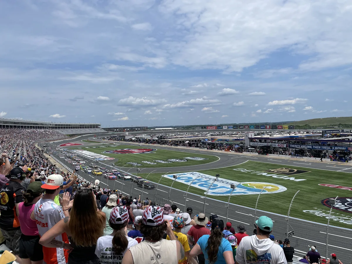 Fans watching a NASCAR race from the Charlotte Motor Speedway grandstands