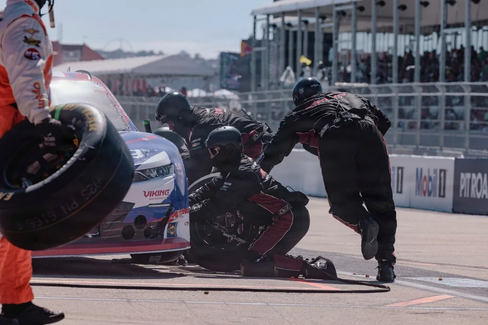 Pit crew changing tires on a 2026 NASCAR O’Reilly Auto Parts Series car at Naval Base Coronado