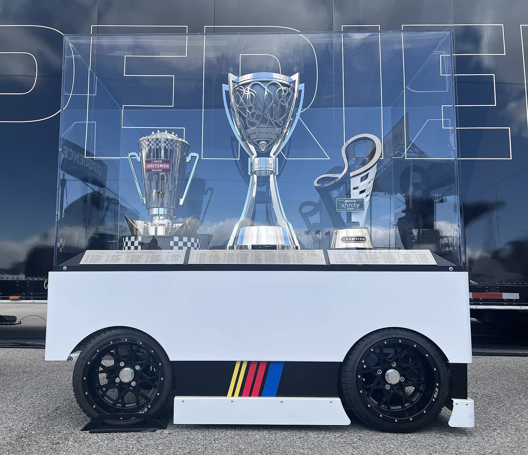 NASCAR national series championship trophies displayed together