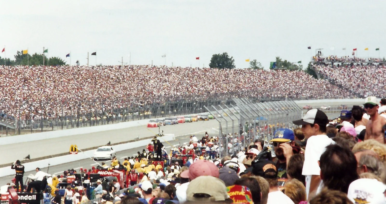 NASCAR Cup Series cars forming two lanes for a restart