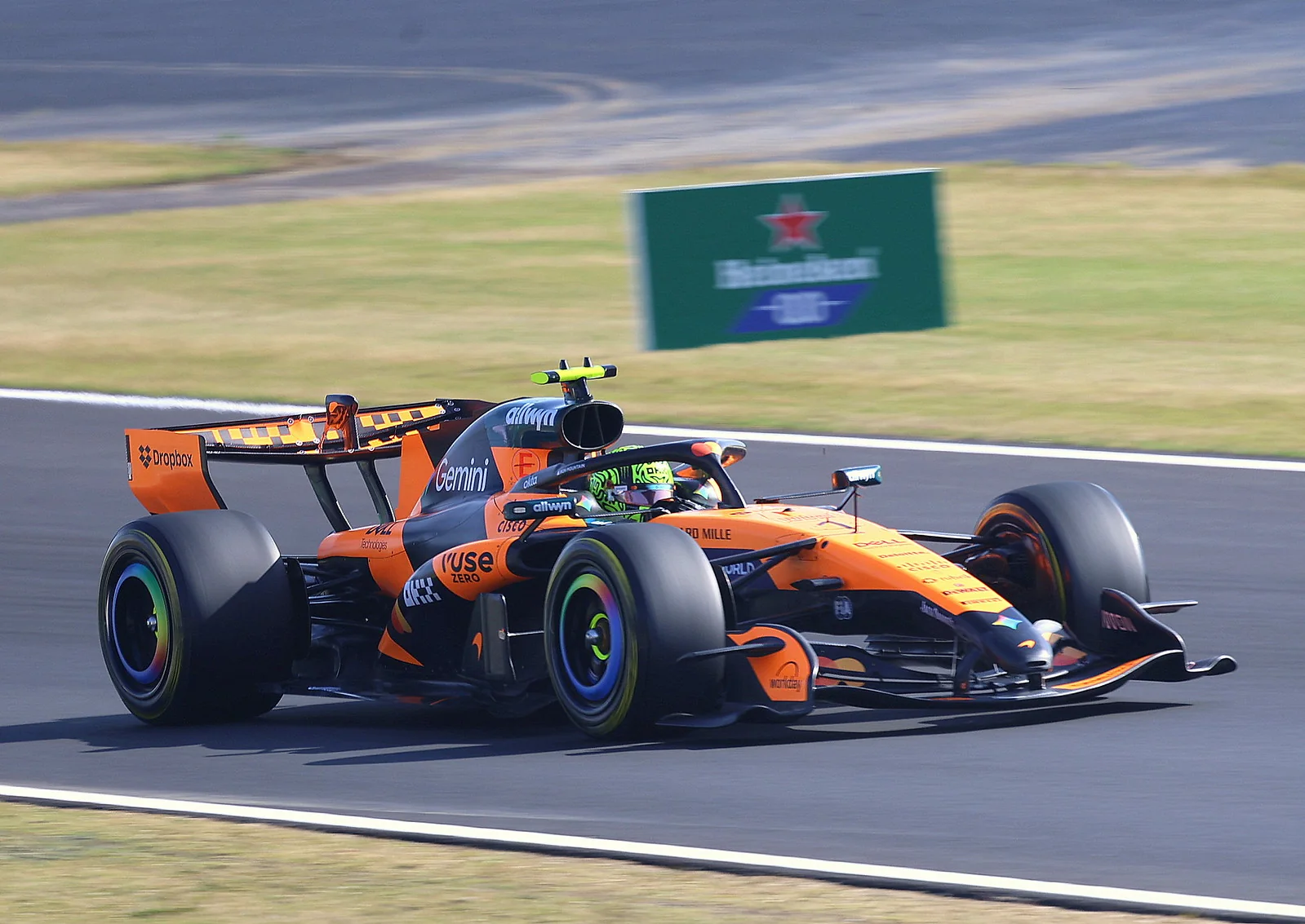 A modern Formula 1 car cornering on a road circuit